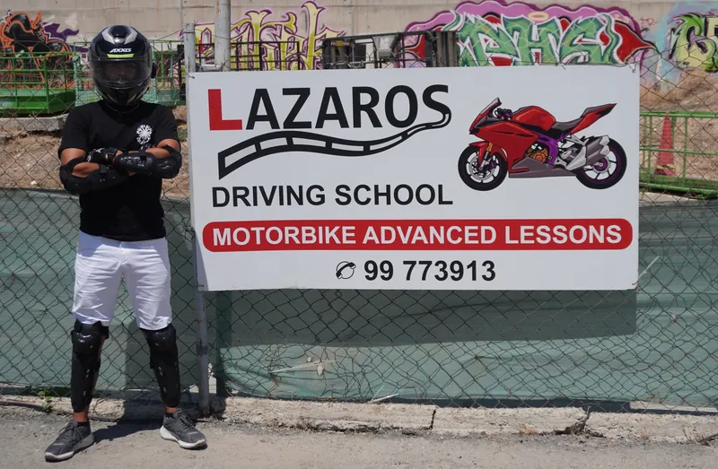 Student wearing the helmet, gloves and guards provided for motorcycle lessons